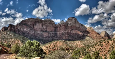 red rock canyon formations under cloudy sky